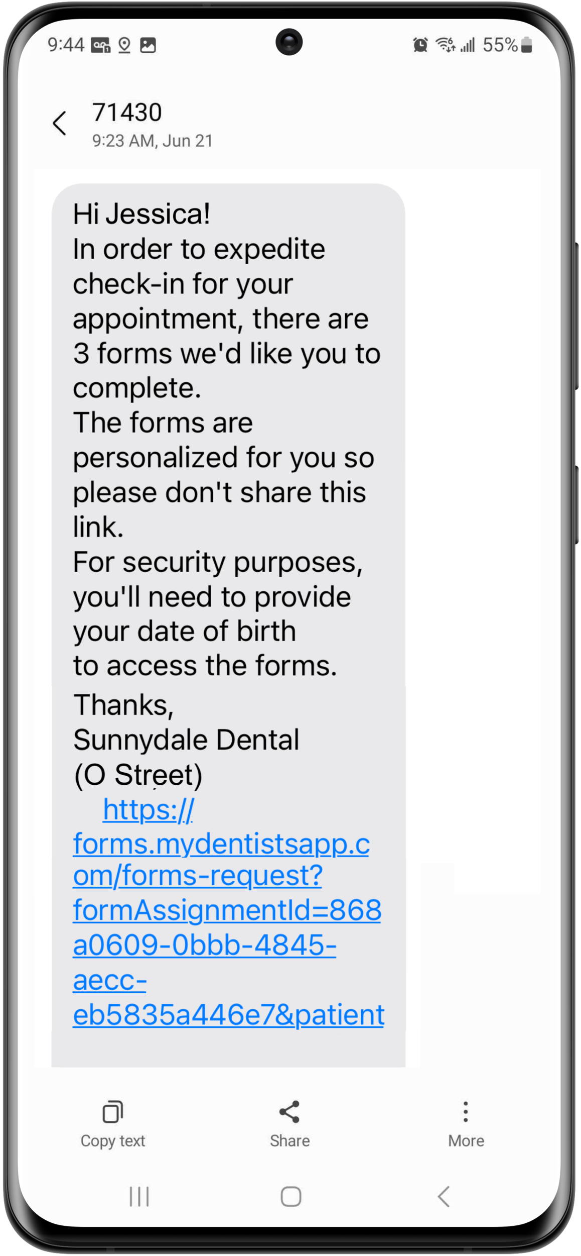 Phone showing text from a practice asking a patient to complete forms for their appointment along with a link.