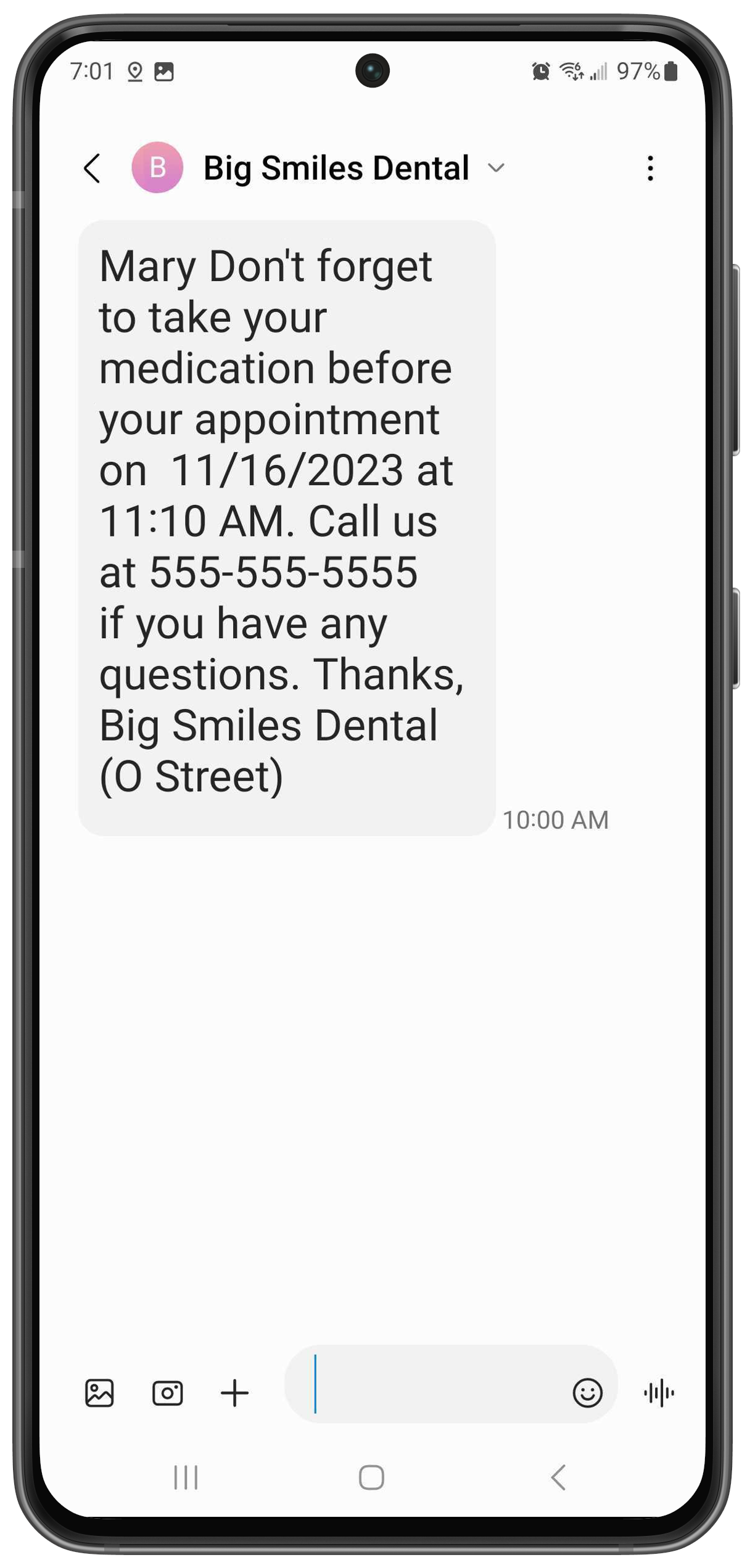 Phone with a text that reads "Mary, Don't forget to take your medication before your appointment on November 16, 2023 at 11:10AM. Call us at 555-555-5555 if you have any questions. Thanks, Big Smiles Dental."
