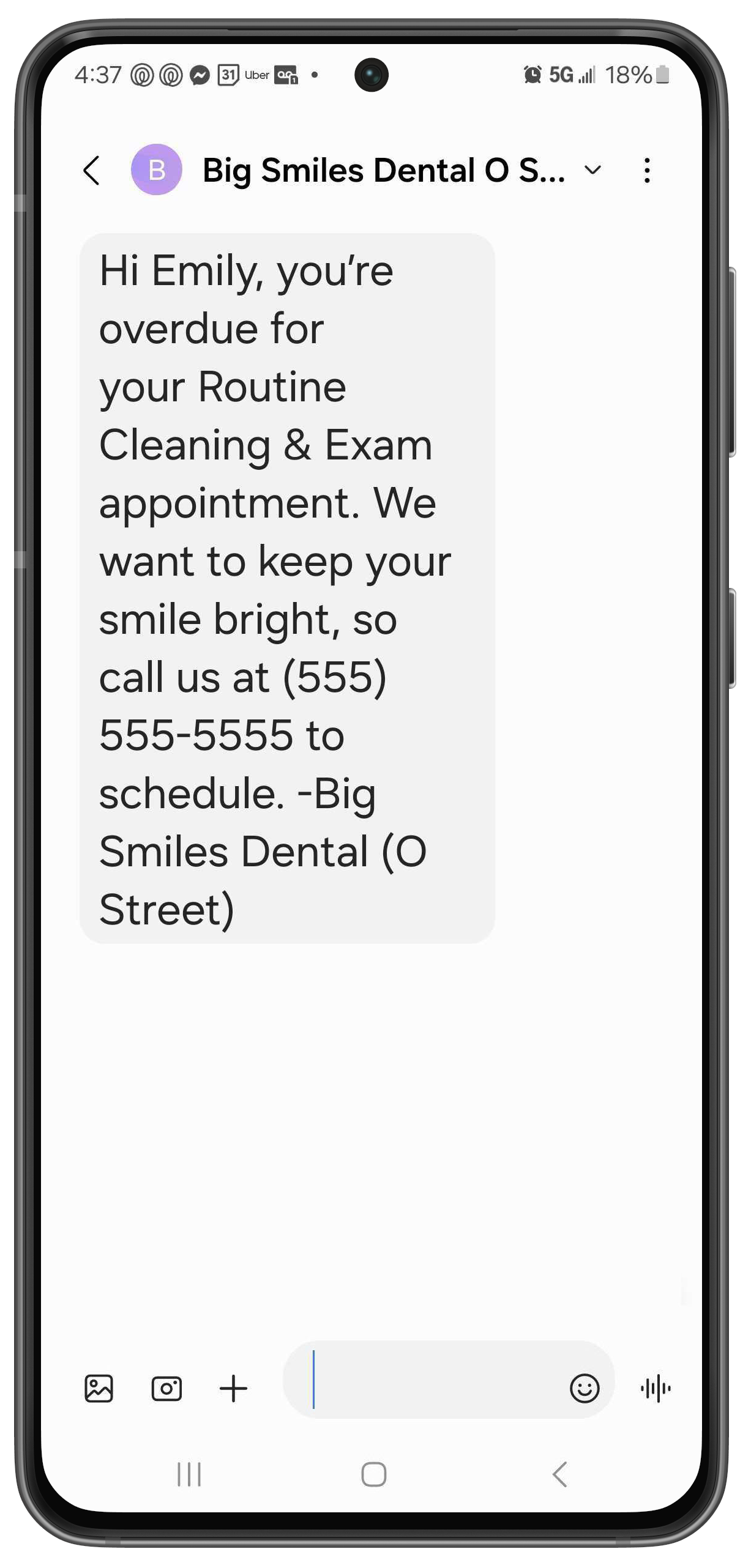 Phone with a text letting a patient know they're overdue for an appointment and and lists the practice name and phone number.