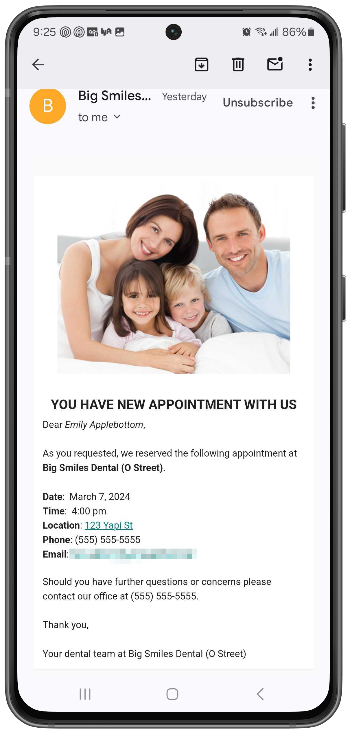 Phone with patient's confirmation email showing details of the appointment they booked.
