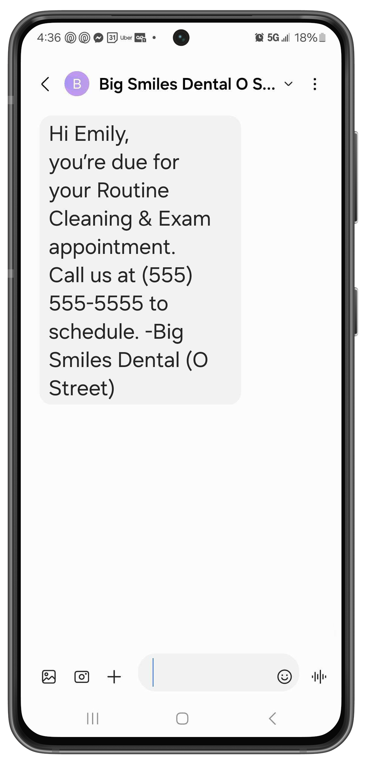 Phone with a text letting a patient know they're due for an appointment and and lists the practice name and phone number.