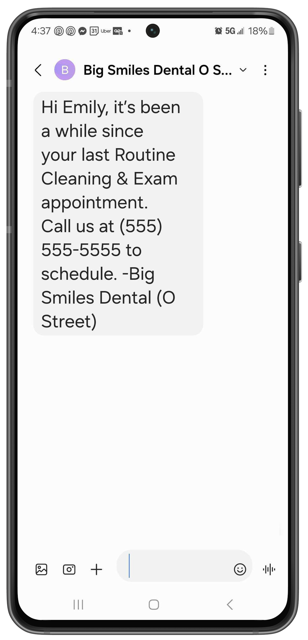 Phone with a text letting a patient know it's been a while since they've had an appointment and and lists the practice name and phone number.